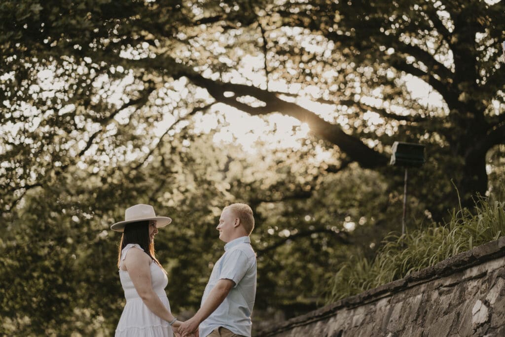 Engaged couple looking at each other at Fair Hill Nature Center in Maryland